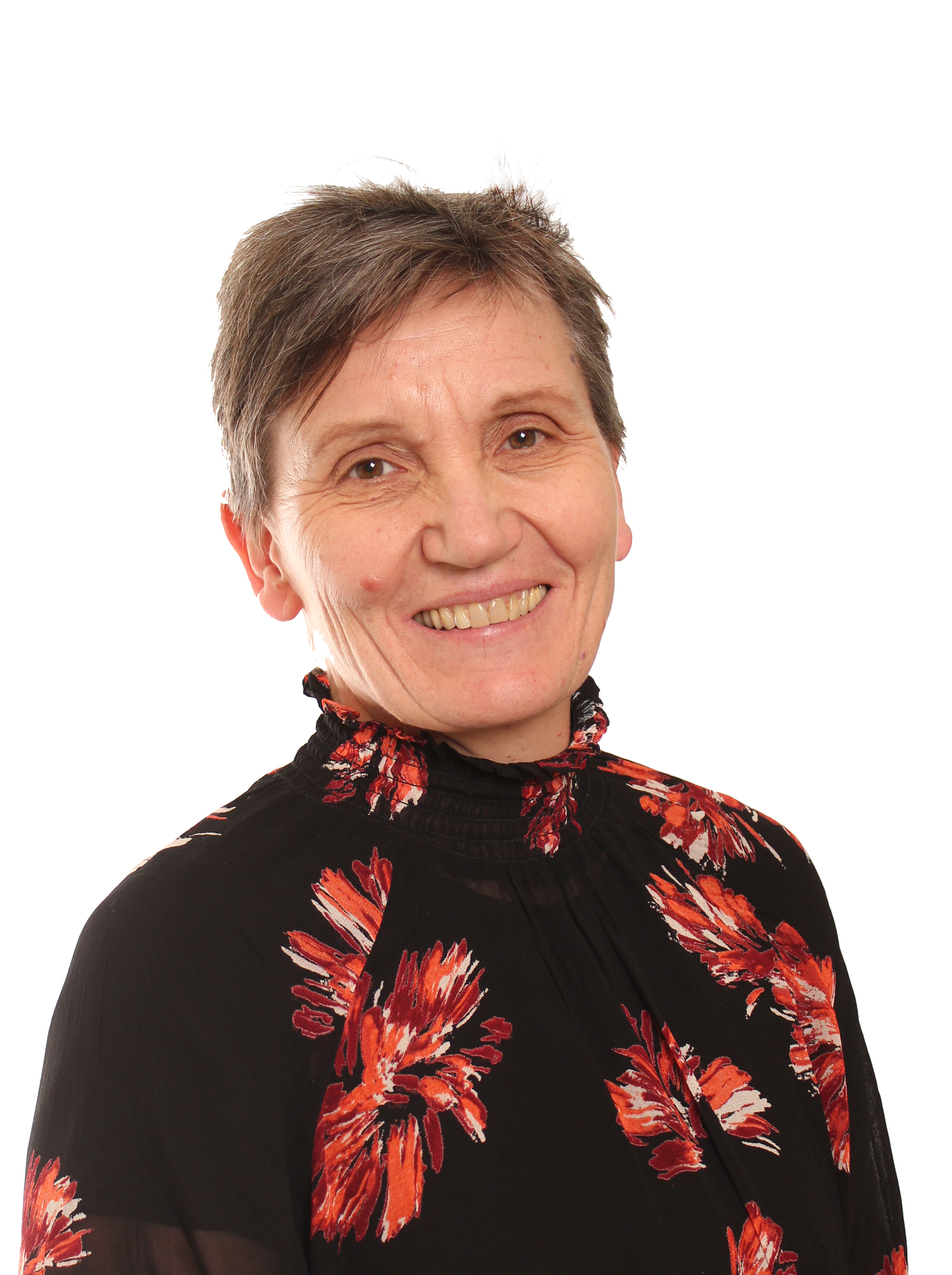 En mann som smiler til kameraet